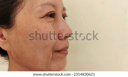 portrait the Wrinkles and Flabby skin, freckles and blemish on the face, cellulite and bag under the eyes, ptosis and flabby skin beside the eyelid, dark spots and rough skin ,health care and beauty. Royalty-Free Stock Photo #2314830621