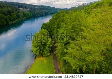 Aerial view of green summer forest and blue river, landscape