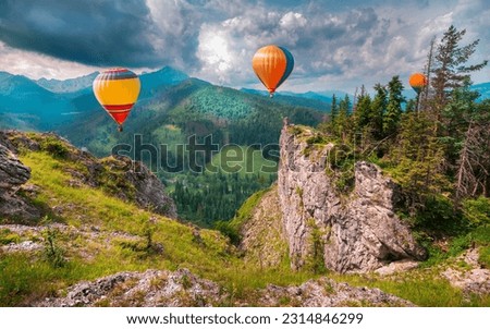 Magnificent Tatra Mountains with hot air balloons. Mountain scenery, amazing panorama with beautiful views. Poland, Zakopane. Amazing adventure ballooning. High Tatras mountains. Royalty-Free Stock Photo #2314846299