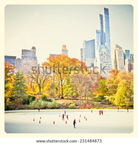 Ice skaters having fun in New York Central Park in fall with Instagram style filter