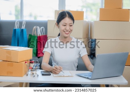 small business owner Young Asian woman working freelance at home Happy woman working with boxes