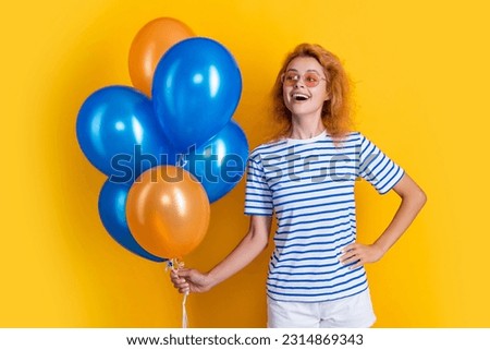 glad woman with birthday balloon in sunglasses. happy birthday woman hold party balloons