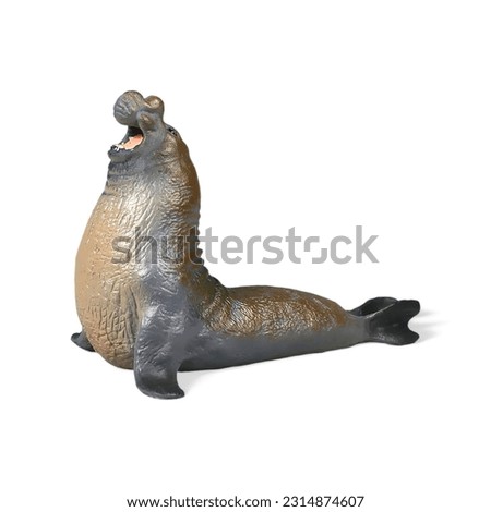 Close-up of a miniature toy elephant seal animal on a white background