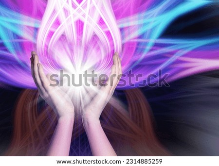 Aura phenomena. Woman with flows of energy making beautiful pattern between her hands against black background, closeup Royalty-Free Stock Photo #2314885259
