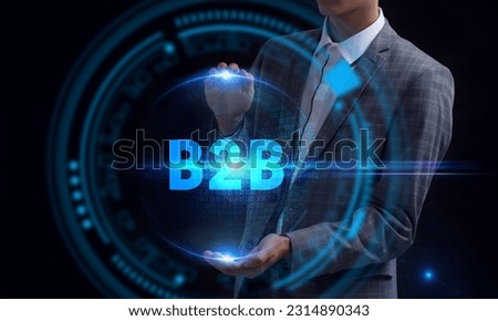 Business, Technology, Internet and network concept. Young businessman working on a virtual screen of the future and sees the inscription: B2B