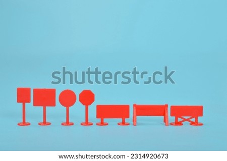 Red plastic signs isolated on a white background. Copy space for the text.