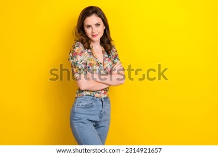 Photo of cheerful sweet woman dressed vintage flower print arms folded empty space isolated yellow color background