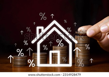 Real estate market growth and home investment concept Human hands dropping coins and mockup houses with piles of coins growing. Property tax and inflation insurance, home taxes, home interest