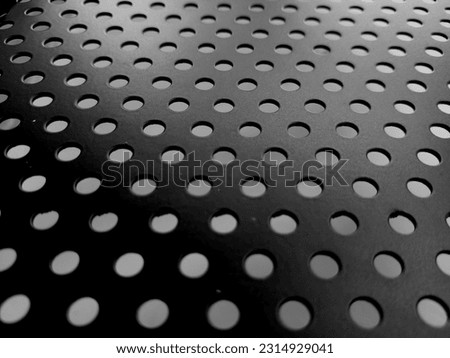 Photo of the small round hole in the thin steel plate seat back