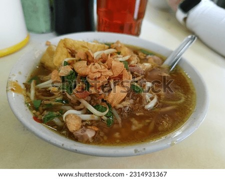 Indonesian traditional chicken soup called "soto ayam" which uses ingredients such as chicken, vermicelli, bean sprout with turmeric as main ingredient add in the broth.