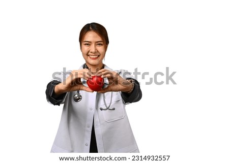Portrait of female doctor cardiologist holding red heart isolated on white background. Cardiology, medical and healthcare concept