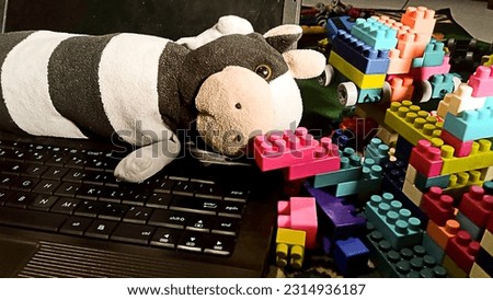 cow doll, lego, and dad's laptop, father's day concept