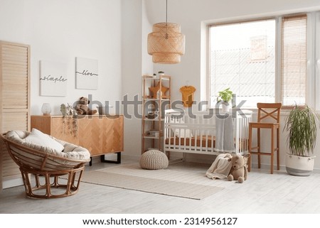 Interior of children's bedroom with wooden cabinet and bed near window Royalty-Free Stock Photo #2314956127