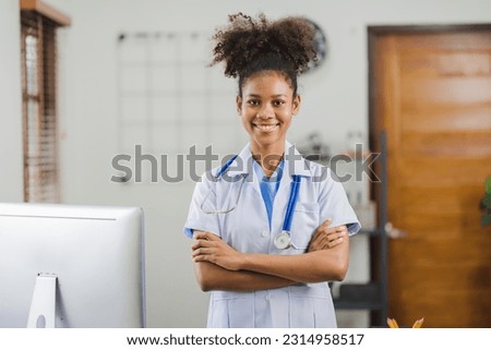 African american woman doctor standing in her clinic office