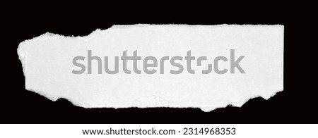 white paper ripped message torn, isolated on black Royalty-Free Stock Photo #2314968353