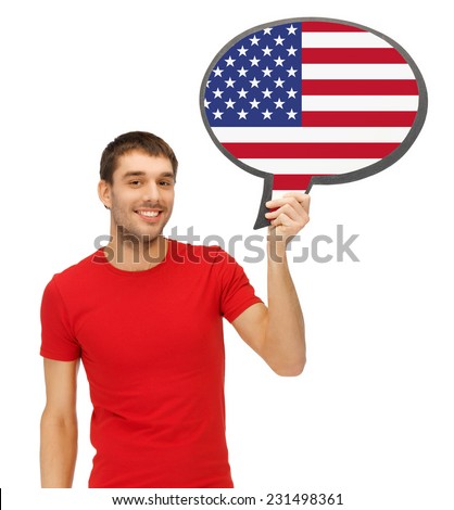 education, foreign language, english, people and communication concept - smiling young man holding text bubble of american flag