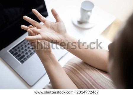 Female office worker suffering from trigger finger disease,painful in fingers and wrist,hurt the hand,health problems,Concept of Trigger Finger,Digital Flexor Tenosynovitis or Stenosing Tenosynovitis Royalty-Free Stock Photo #2314992467