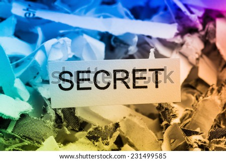 shredded paper tagged with secret symbol photo for data destruction, bank secret and economic espionage