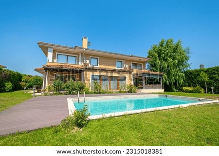 Style pool garden of modern villa Royalty-Free Stock Photo #2315018381