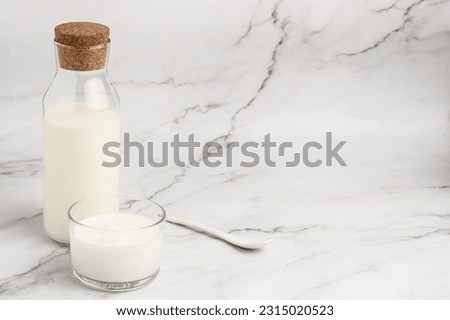 lactose free yogurt, kefir, fermented milk on a light background. Healthy, clean eating. Vegan or gluten free diet, Royalty-Free Stock Photo #2315020523