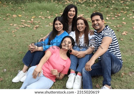 indian five true friends fully enjoying and sitting in the park lovely friends charming and adorable indian female Royalty-Free Stock Photo #2315020619