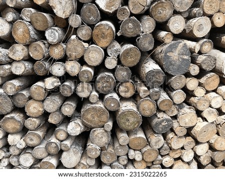 Pile of log wood for wall design