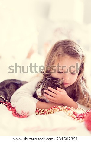 Cute baby girl with her cat