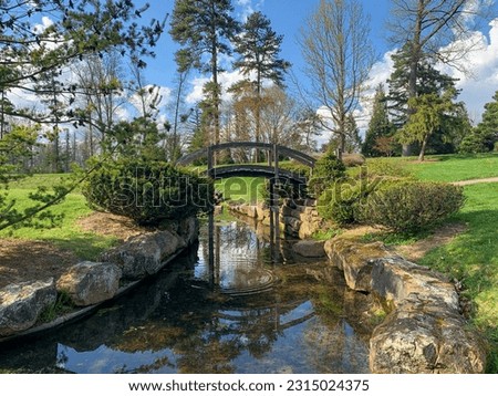 Dawes Arboretum Japanese Garden with Koi pond and water reflections on a sunny day Royalty-Free Stock Photo #2315024375