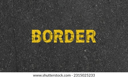 Border Crossing sign on road way used to prevent border dispute and illegal immigration.