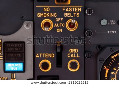 Airplane cockpit control switches for seatbelts and no smoking sign