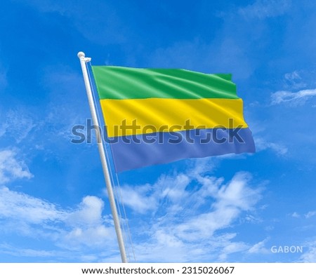 Flag on Gabon flag pole and blue sky, Flag of Gabon fluttering in blue sky big national  symbol. Waving green, yellow and cyan Gabon flag, Independence Constitution Day. Royalty-Free Stock Photo #2315026067