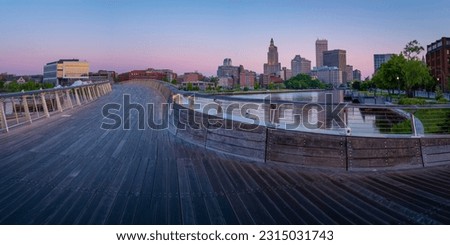Providence City downtown skyline, buildings, and curving pedestrian bridge over the Providence River in Rhode Island, sunrise cityscape Royalty-Free Stock Photo #2315031743