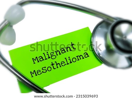 Malignant mesothelioma, term written on a piece of black paper with stethoscope. Royalty-Free Stock Photo #2315039693