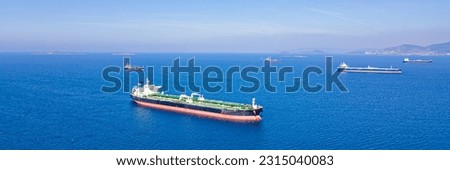 Aerial wide shot of Crude Oil Tankers ships anchorage near sea port, Export Import of Crude Oil. Wide banner
