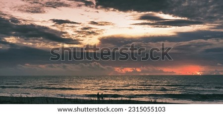 Storm clouds at sunrise over Sea ranch beach in Indialantic Florida