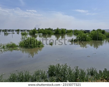 Kherson, Kherson region, Ukraine 06 06 2023 Photo of the flooded shore after  blew up the dam at the Kakhovka HP Royalty-Free Stock Photo #2315077321