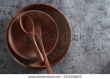          Plates and spoons made of wood are used for food photo props                     