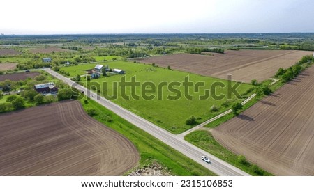 Aerial view of farmland in the Duffins Rouge Agricultural Preserve, Durham County, Ontario, Canada. Spring 2023 Royalty-Free Stock Photo #2315106853