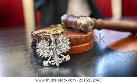 06.07.2023 wroclaw, poland, Polish court trial law insignia lies on the bench. Royalty-Free Stock Photo #2315132943