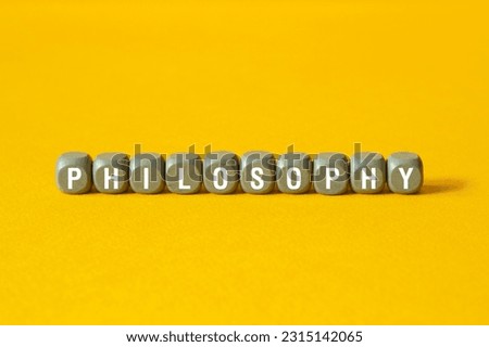 Philosophy - word concept on building blocks, text