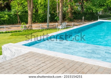 Empty swimming pool in summer.