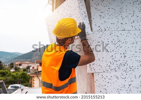 Polystyrene thermal cladding for energy saving on a construction site Royalty-Free Stock Photo #2315155213