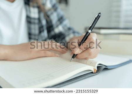 Student, use left-handed, inspiration, writer, writing ,creative ,recreation for imagine, writing ideas on notebook, to do list, good thinking work, journalist, Stylish, Dream image, relax, designer Royalty-Free Stock Photo #2315155329