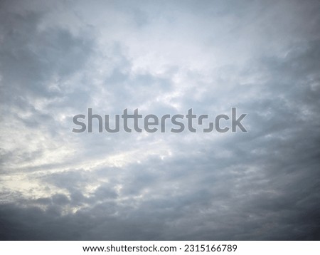 background view of a slightly overcast cloudy sky during the morning of the rainy season Royalty-Free Stock Photo #2315166789