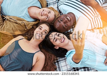 Friends, top view and picnic with circle selfie, happiness or diversity for social media post, app or blog. Men, woman and students for photography, profile picture or solidarity with lying on ground