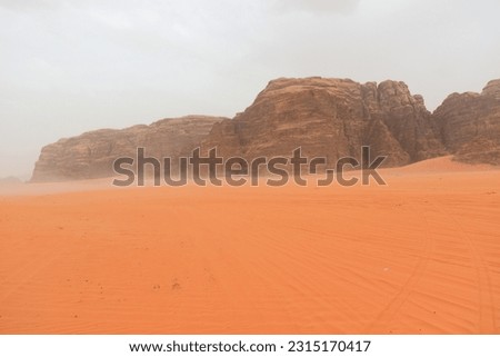 Wadi Rum Desert, Jordan. The red desert and Jabal Al Qattar mountain. 8th July 2023. On a hot spring cloudy day. 