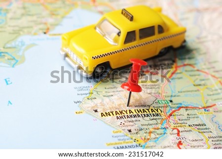 Close up of  Antakya Hatay ,Turkey  map with red pin  and a taxi  - Travel concept