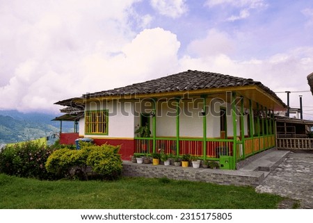 Beautiful traditional house of the Colombian coffee axis Royalty-Free Stock Photo #2315175805