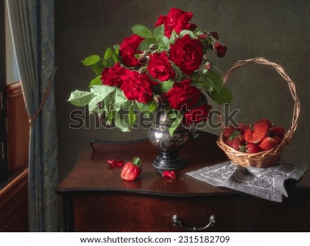 Still life with red roses and strawberries