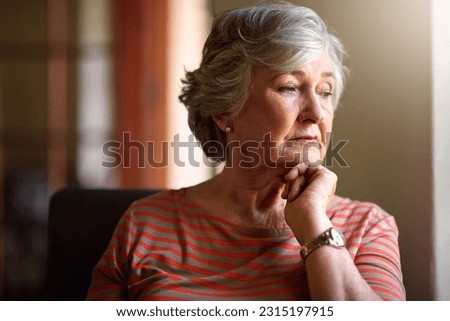 Senior woman, worry and thinking at window with memory, ideas and home on living room sofa. Elderly lady, remember and think with decision, depression and retirement on lounge chair, house and fear Royalty-Free Stock Photo #2315197915
